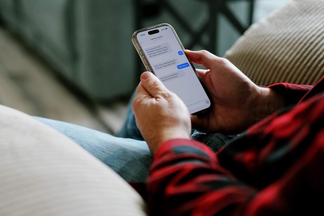 Smartphone showing a spam text message with a block option